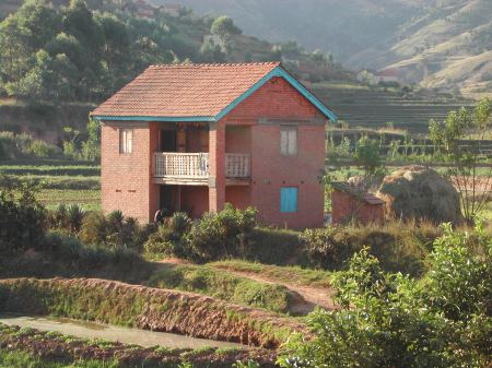 Farmhouse among the intensively cultivated rice terraces of Betafo, west of Antsirabe